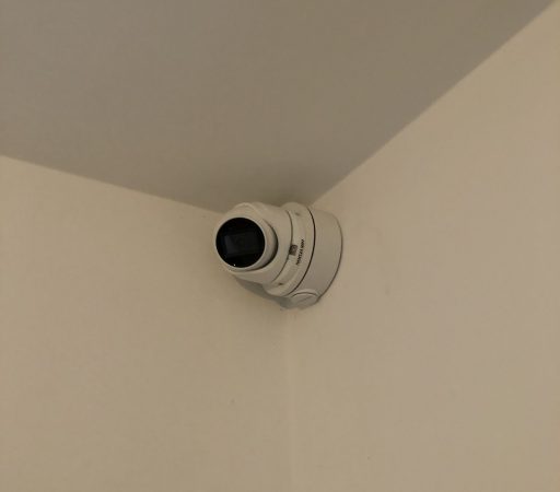 Cctv camera on the ceiling of a room.