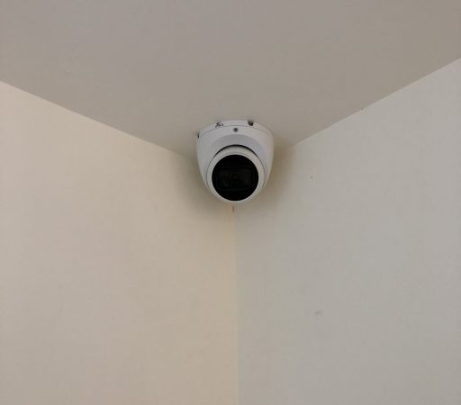 Cctv camera in the corner of a room.