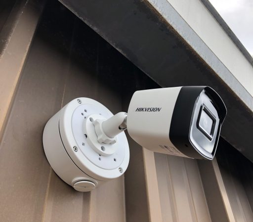 A security camera mounted on the side of a building.