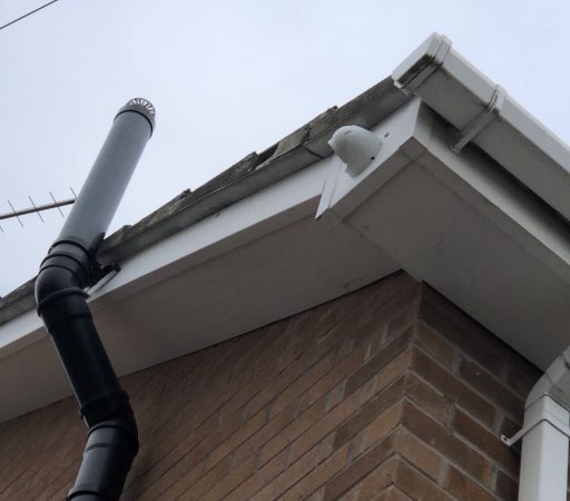 A chimney with a pipe attached to it.