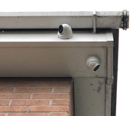 Cctv cameras on the side of a building.